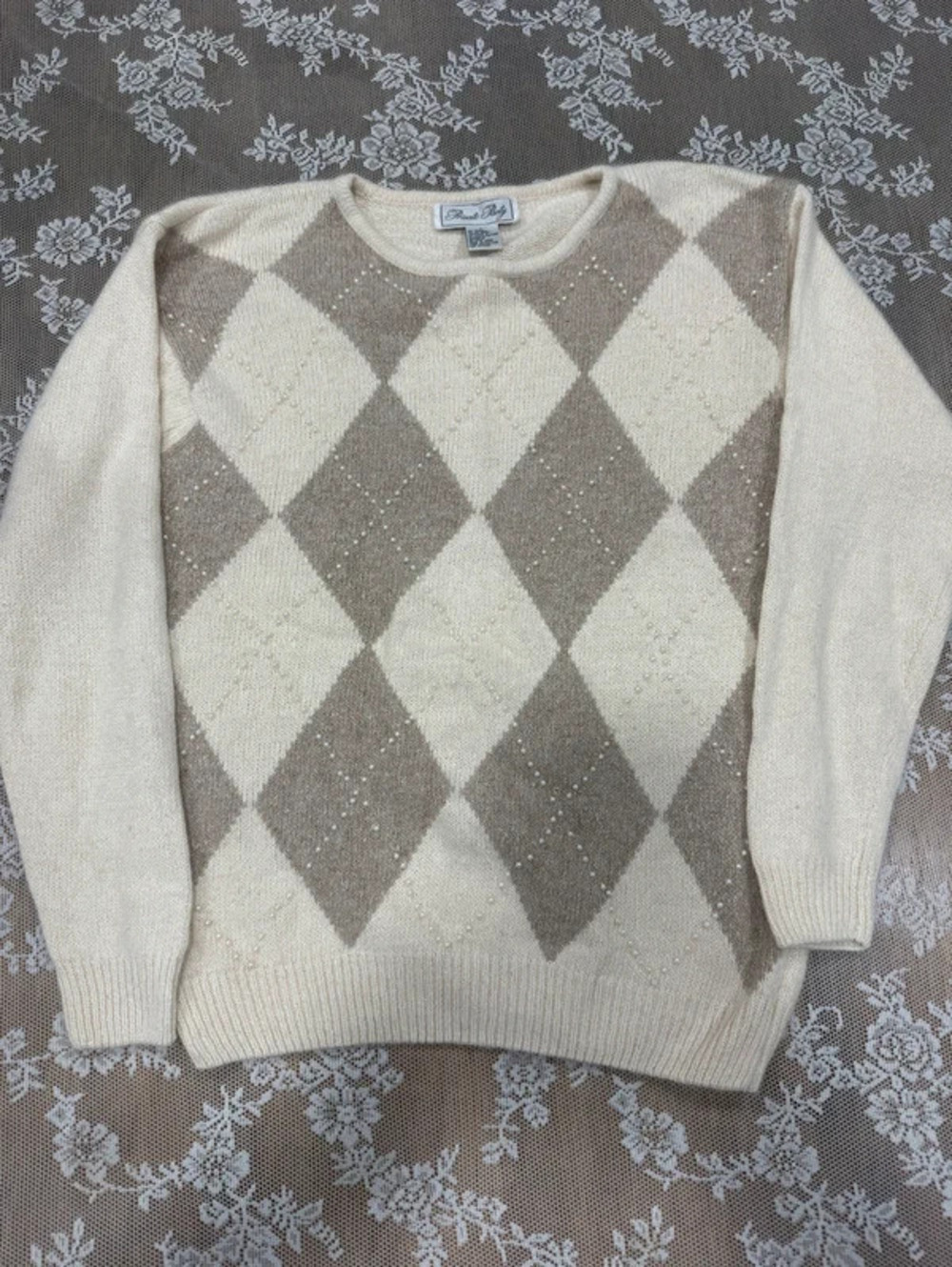 cream sweater with pearl detail